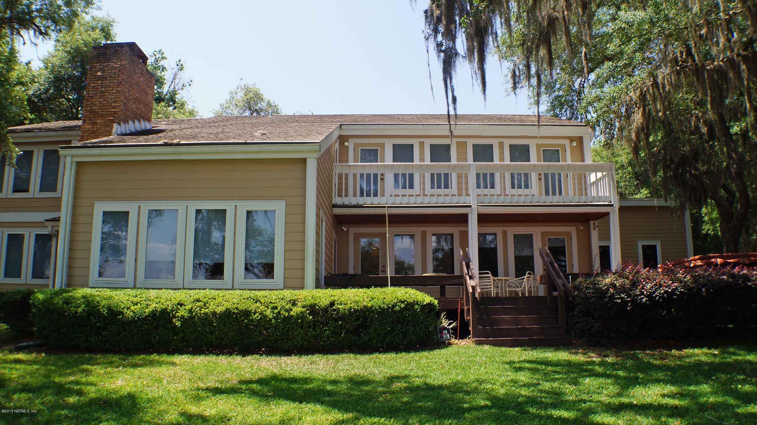 6674 Brooklyn Bay Road Keystone Heights, FL 32656 - Photo 4 of 57 a front view of a house with a yard