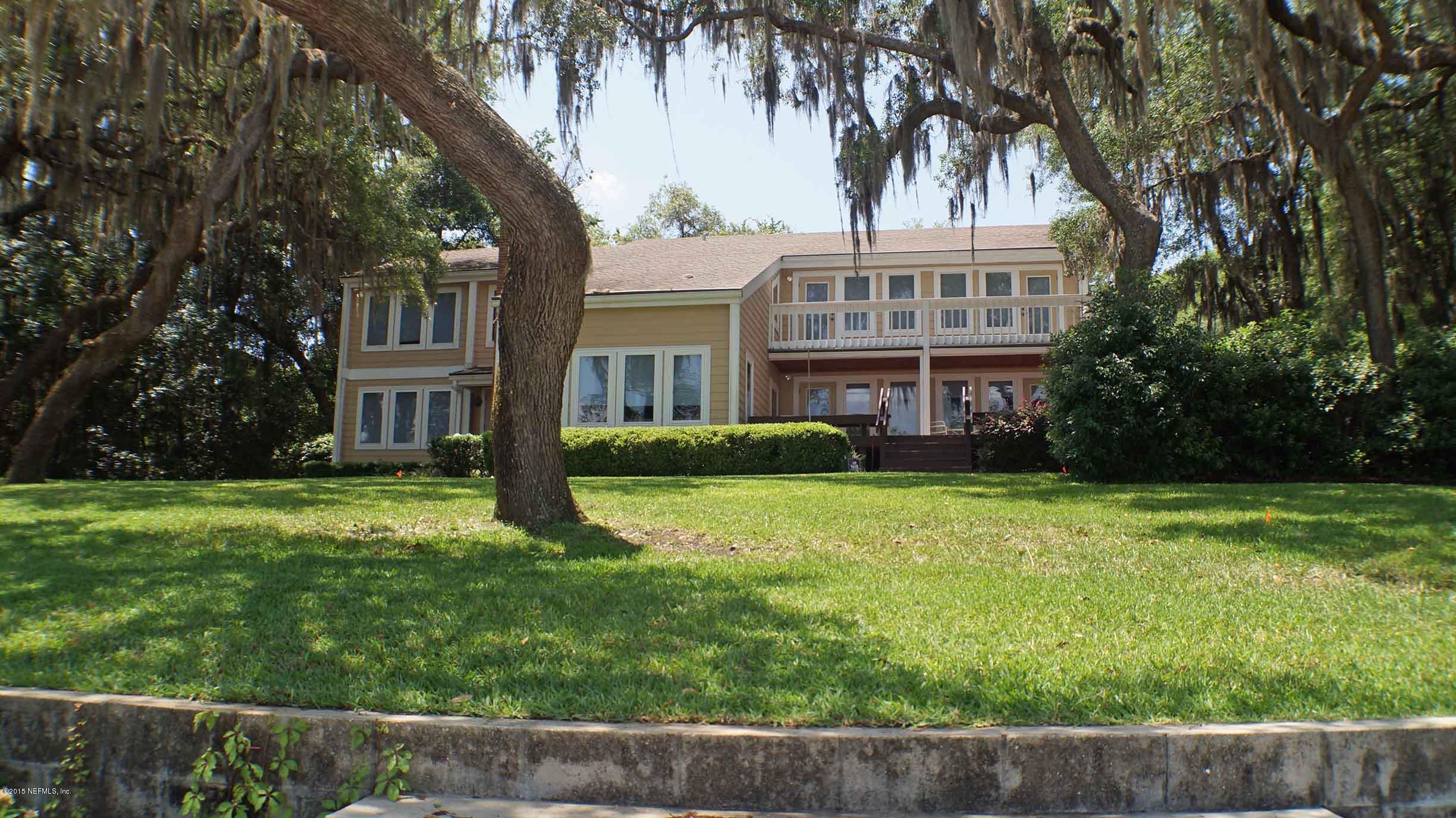 6674 Brooklyn Bay Road Keystone Heights, FL 32656 - Photo 45 of 57 a front view of a house with a garden