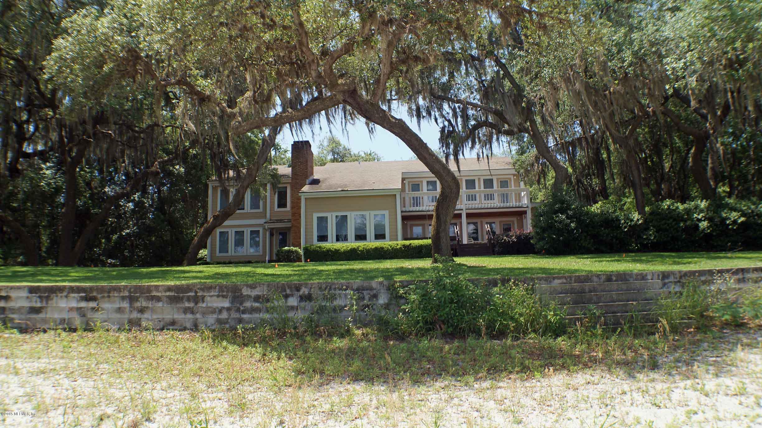 6674 Brooklyn Bay Road Keystone Heights, FL 32656 - Photo 46 of 57 a front view of a house with a yard