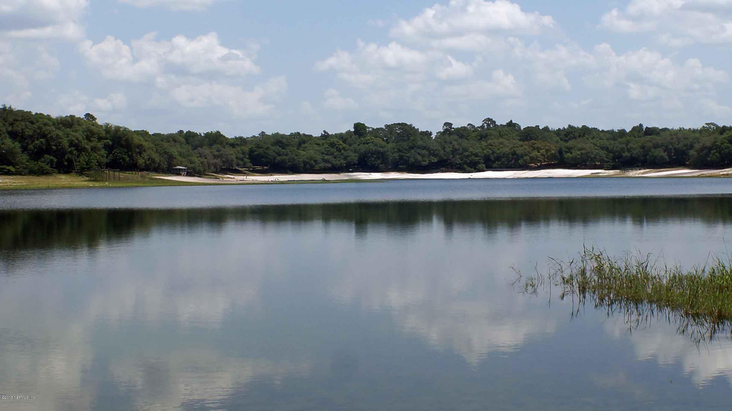6674 Brooklyn Bay Road Keystone Heights, FL 32656 - Photo 49 of 57 a view of a lake with green space
