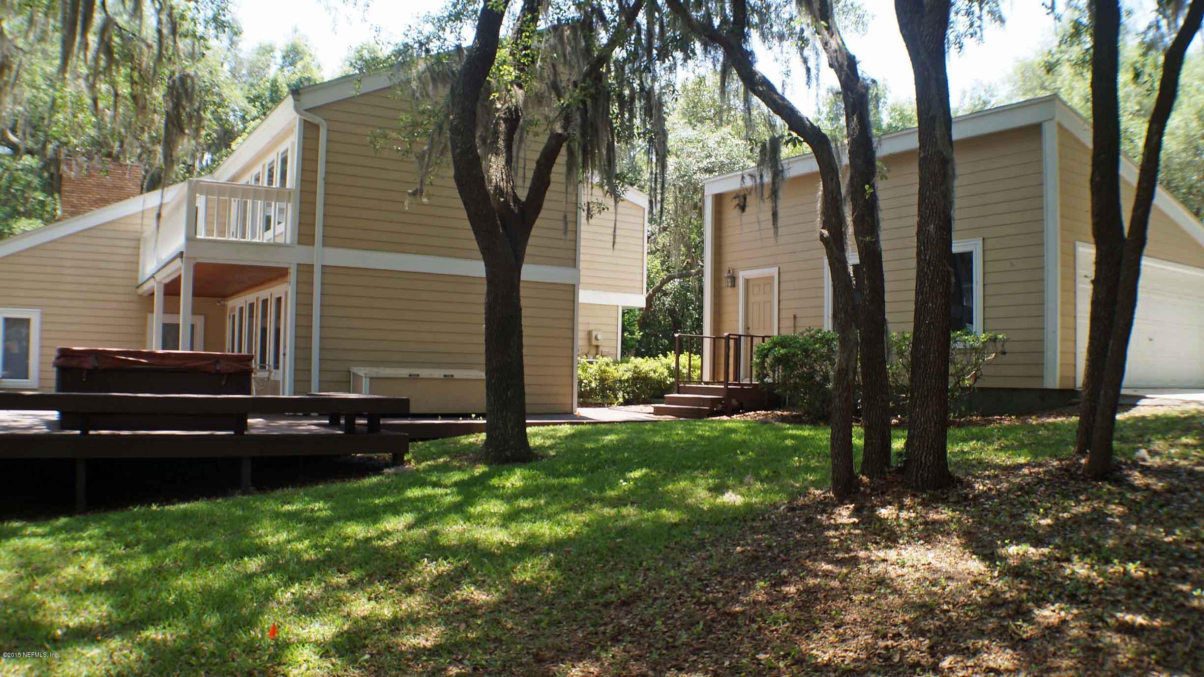 6674 Brooklyn Bay Road Keystone Heights, FL 32656 - Photo 52 of 57 a backyard of a house with lots of green space