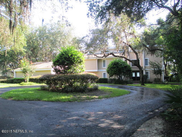 6674 Brooklyn Bay Road Keystone Heights, FL 32656 - Photo 55 of 57 a view of a yard with plants and large trees