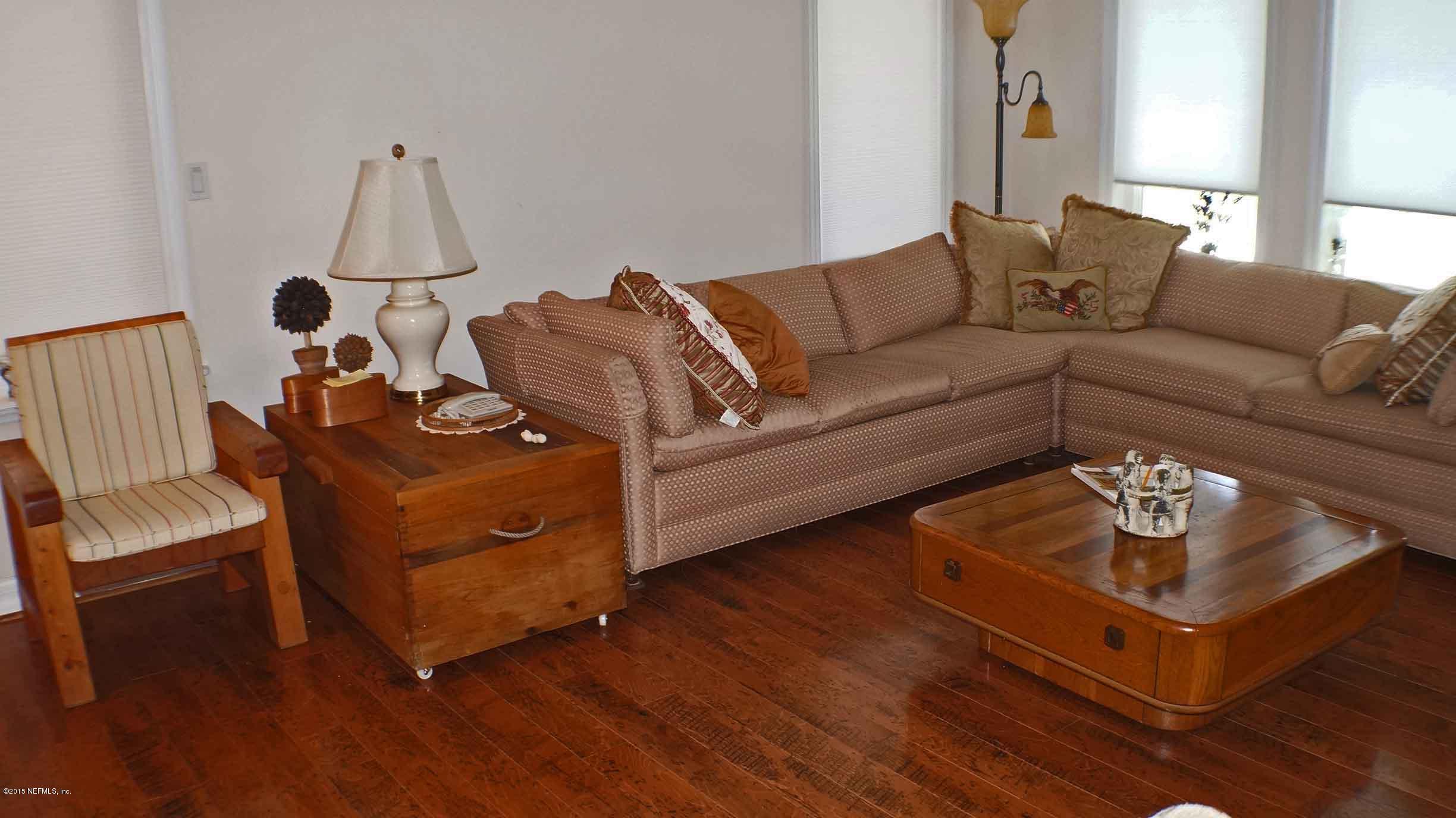 6674 Brooklyn Bay Road Keystone Heights, FL 32656 - Photo 8 of 57 a living room with furniture and wooden floor