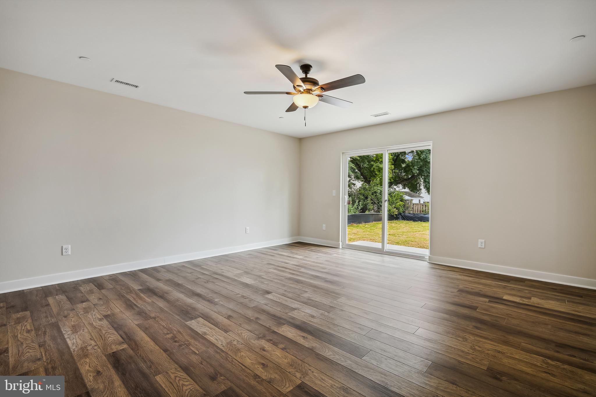8480 Arbutus Road Pasadena, MD 21122 - Photo 36 of 68 LOWER LEVEL FAMILY ROOM W/WALKOUT SLIDER
