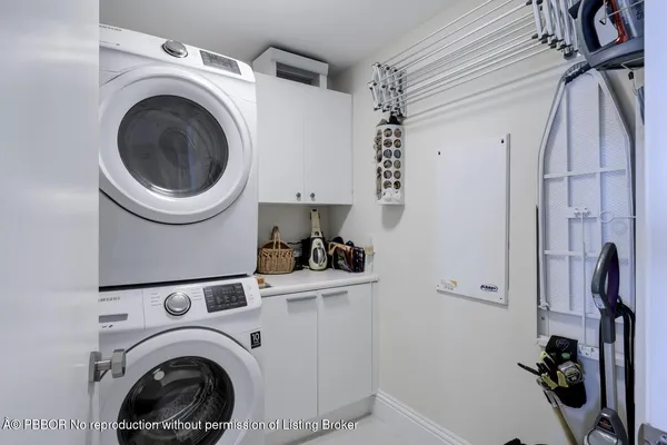 a large kitchen with a large window and stainless steel appliances