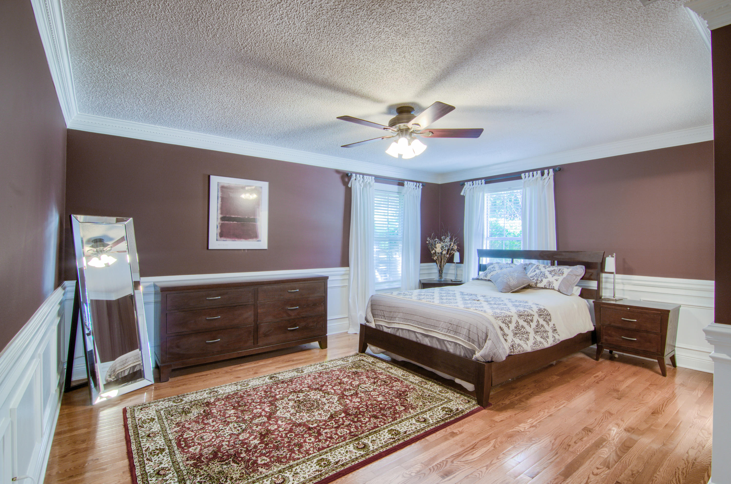 3840 Mesa Road Destin, FL 32541 - Photo 5 of 11 a bedroom with a bed and a chandelier