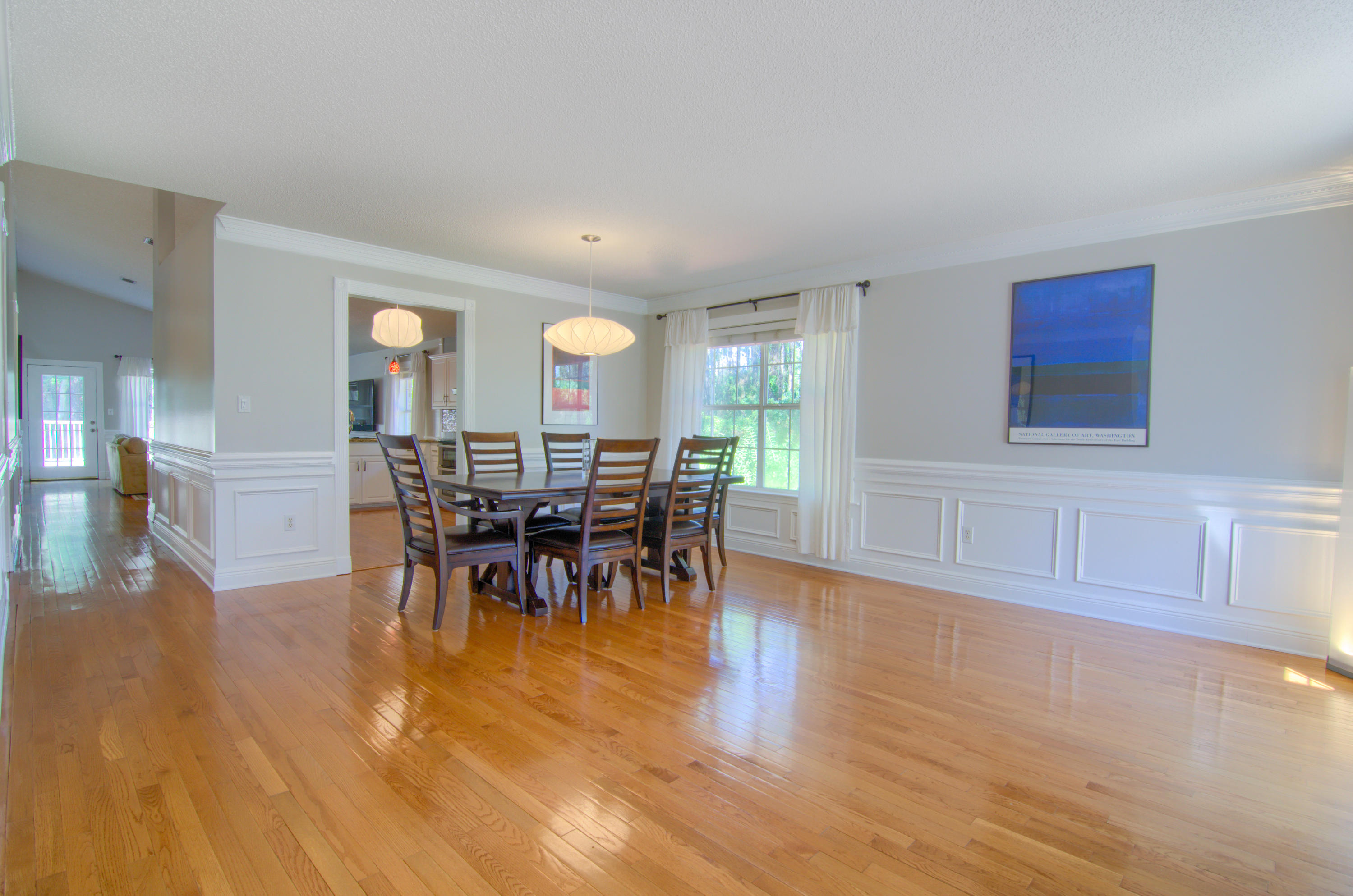 3840 Mesa Road Destin, FL 32541 - Photo 10 of 11 a view of a a dining room with furniture window and wooden floor