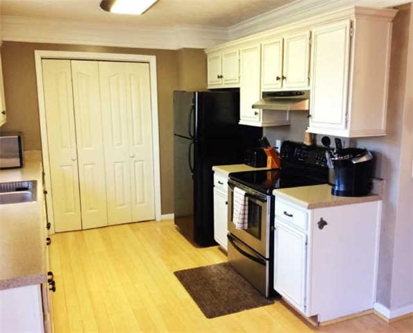 7519 King Road Fairview, TN 37062 - Photo 5 of 17 a kitchen with a refrigerator sink and cabinets