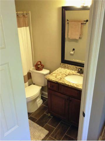 7519 King Road Fairview, TN 37062 - Photo 8 of 17 a bathroom with a sink and mirror with toilet