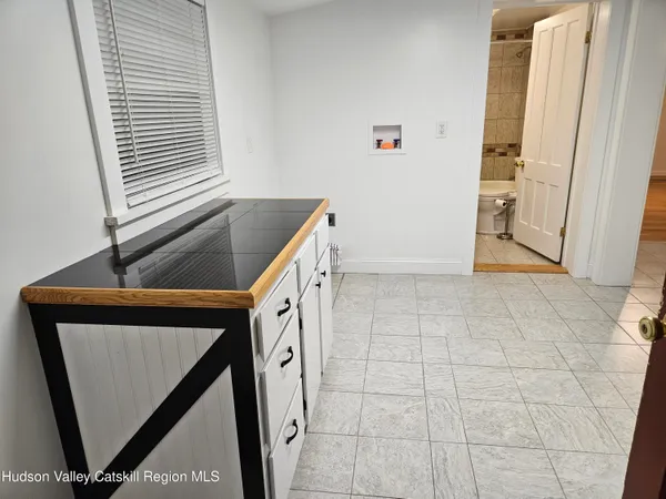 a bathroom with a sink vanity and a mirror