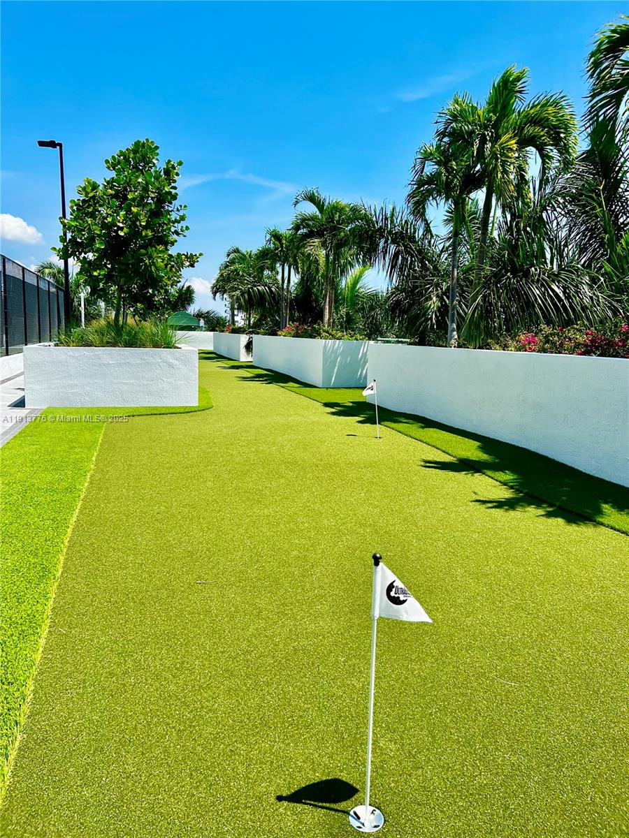1330 West Avenue, Unit 1807 Miami Beach, FL 33139 - Photo 12 of 17 a view of a swimming pool and trees in the background