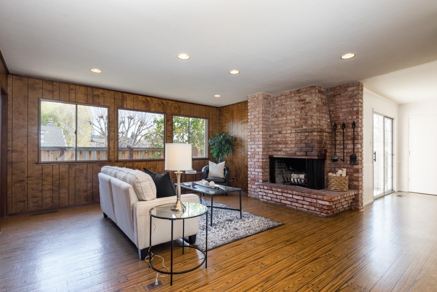 237 Timothy Drive San Carlos, CA 94070 - Photo 12 of 30 a living room with furniture a fireplace and wooden floor