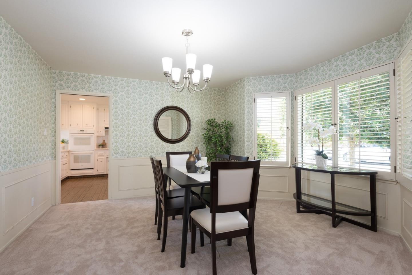 237 Timothy Drive San Carlos, CA 94070 - Photo 13 of 30 a view of a dining room with furniture a chandelier and wooden floor