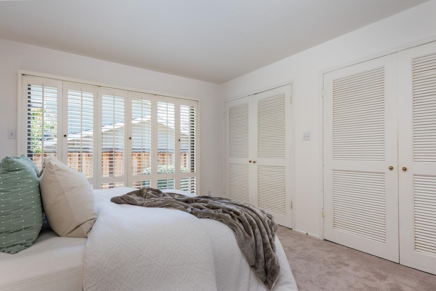 237 Timothy Drive San Carlos, CA 94070 - Photo 18 of 30 a bed sitting in a bedroom next to a window