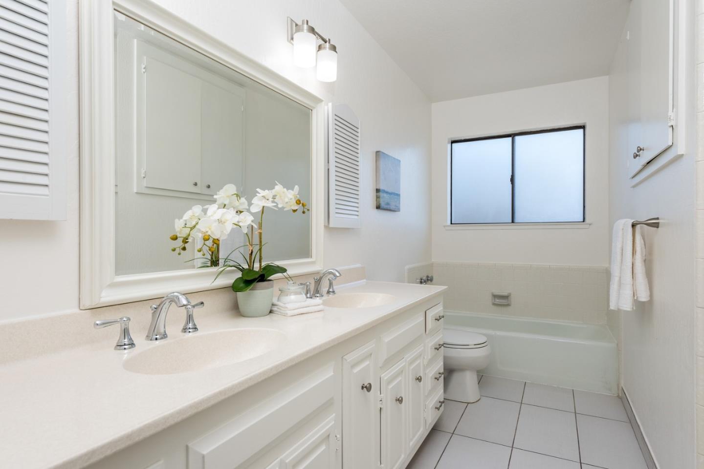237 Timothy Drive San Carlos, CA 94070 - Photo 19 of 30 a bathroom with a double vanity sink toilet and shower