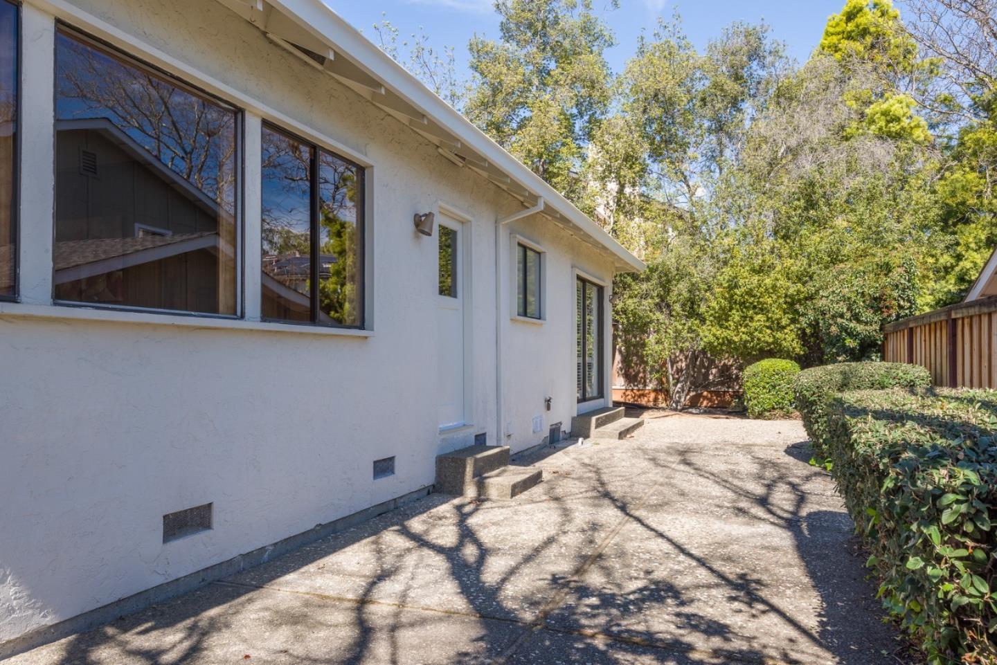 237 Timothy Drive San Carlos, CA 94070 - Photo 27 of 30 a backyard of a house with large trees and plants