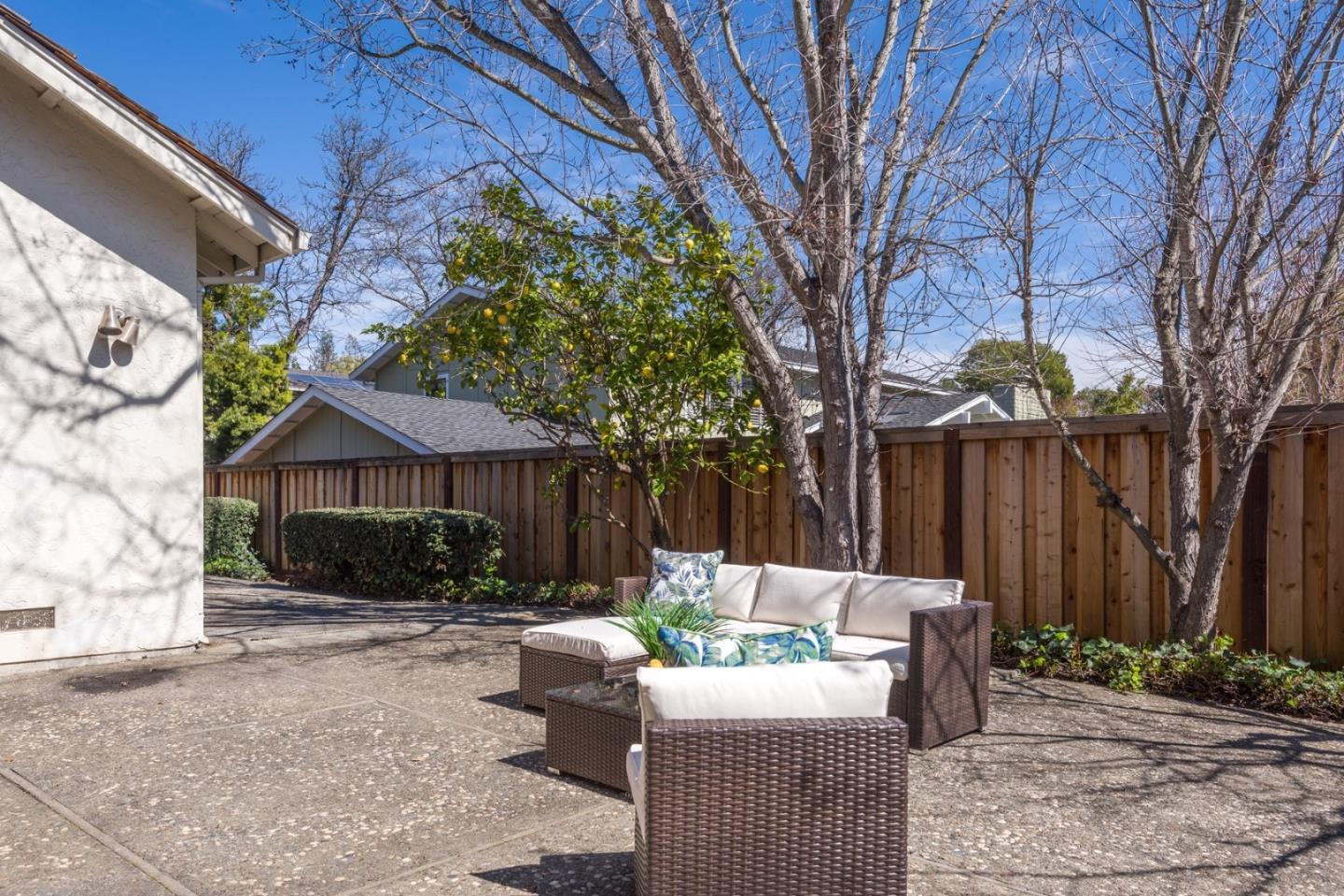 237 Timothy Drive San Carlos, CA 94070 - Photo 29 of 30 a view of backyard with table and chairs and a large tree