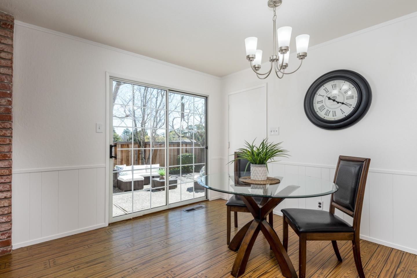237 Timothy Drive San Carlos, CA 94070 - Photo 10 of 30 a dining room with furniture a potted plant and wooden floor