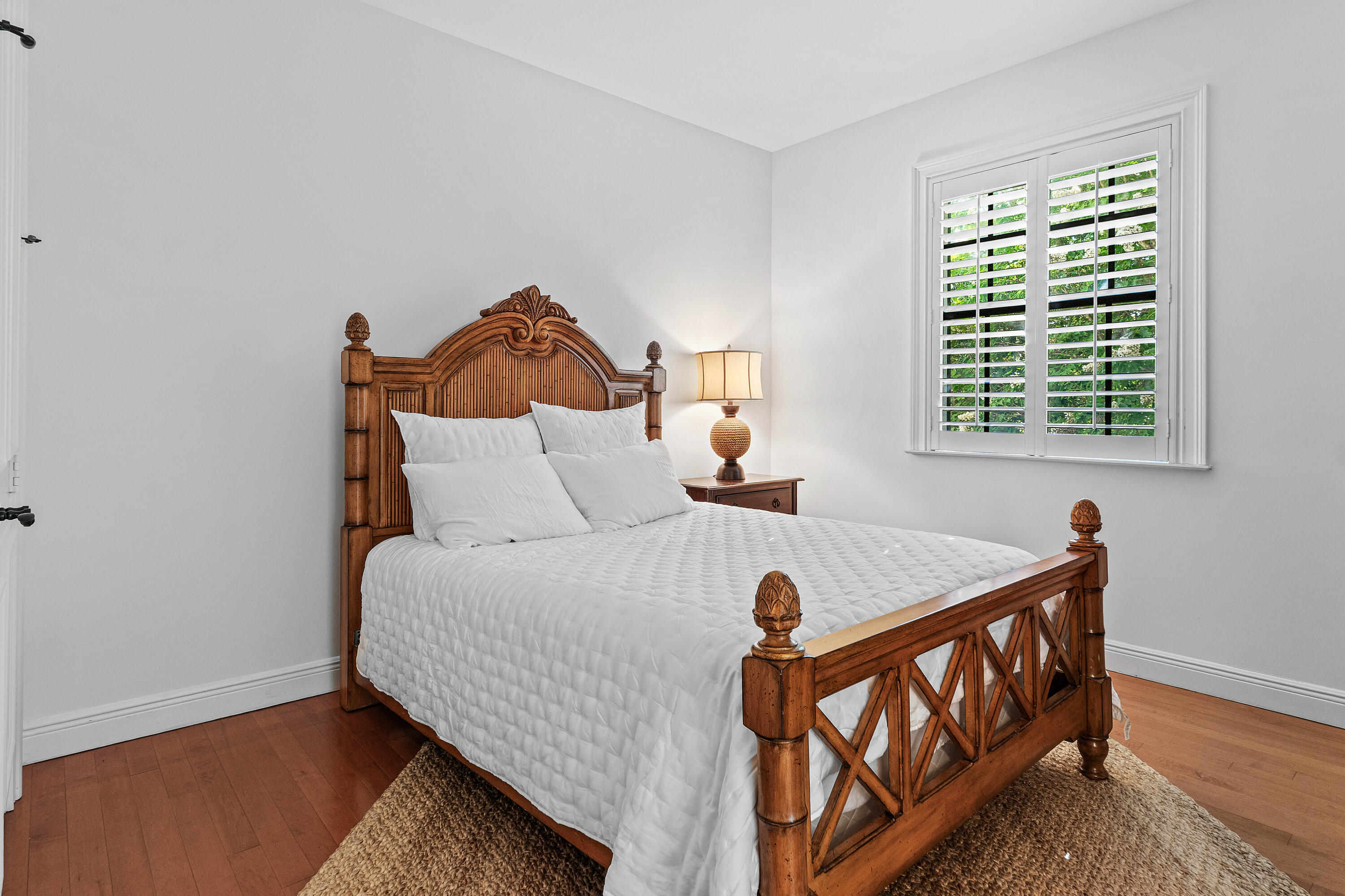 110 Gleason Street, Unit 203 Delray Beach, FL 33483 - Photo 17 of 25 a bedroom with a bed and window