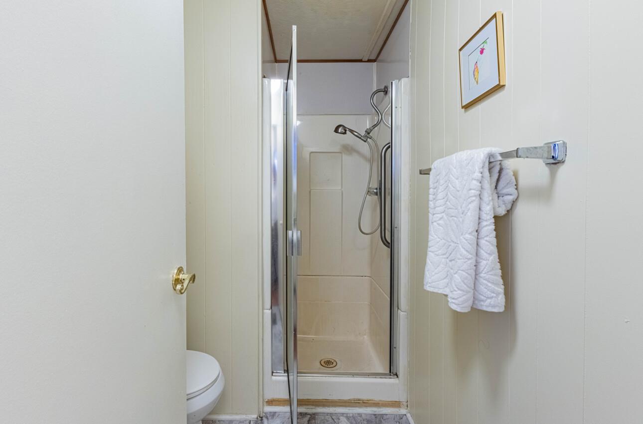 55 San Juan Grade Road, Unit 79 Salinas, CA 93906 - Photo 14 of 22 a bathroom with a shower and toilet