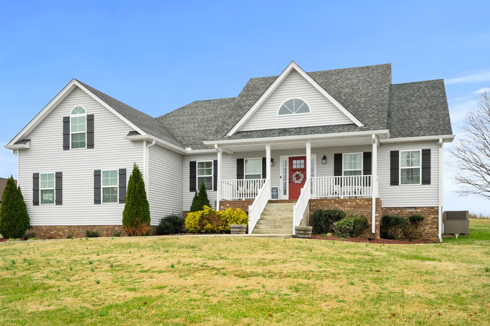 a front view of a house with a yard