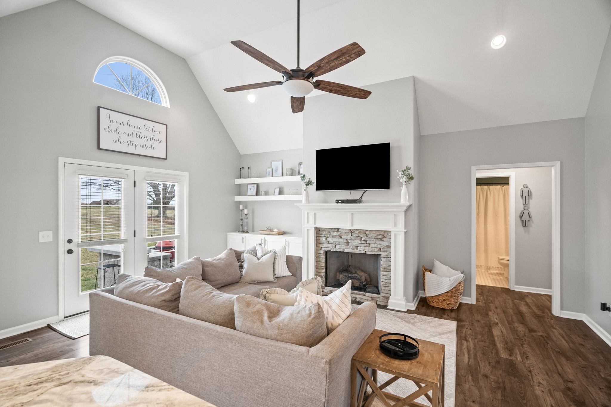 3706 Calista Road White House, TN 37188 - Photo 18 of 55 a living room with furniture a fireplace and a flat screen tv