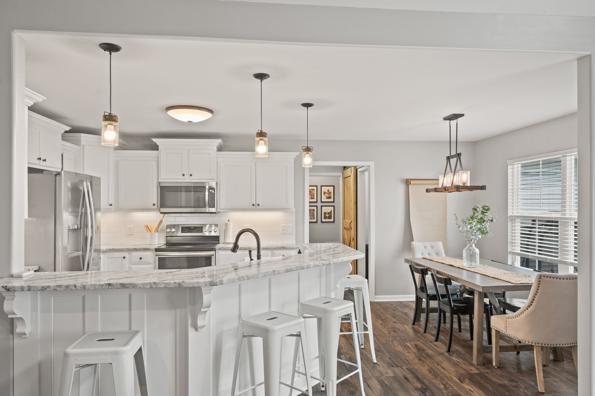 3706 Calista Road White House, TN 37188 - Photo 20 of 55 a kitchen with kitchen island granite countertop a table and chairs