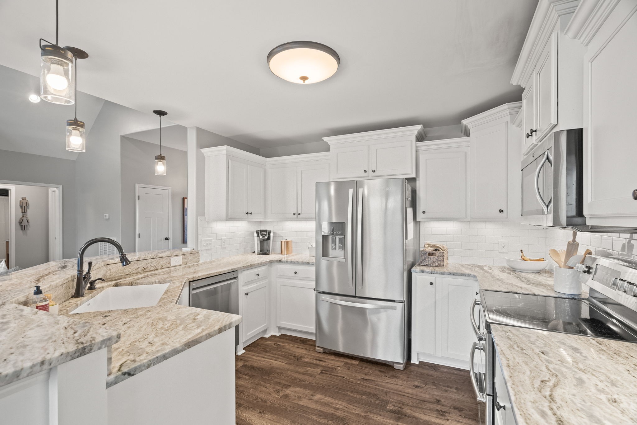 3706 Calista Road White House, TN 37188 - Photo 22 of 55 a kitchen with stainless steel appliances a refrigerator sink and cabinets