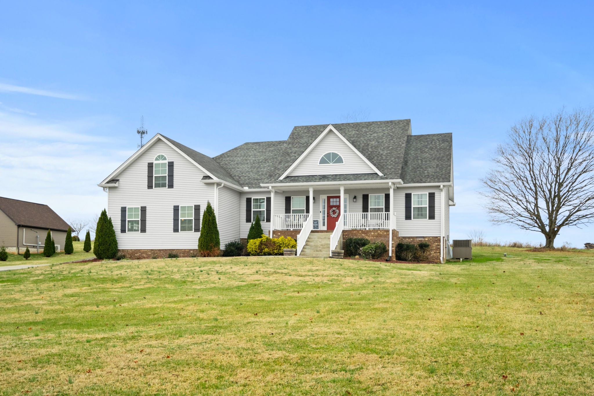 3706 Calista Road White House, TN 37188 - Photo 6 of 55 a view of a house with a big yard and large trees