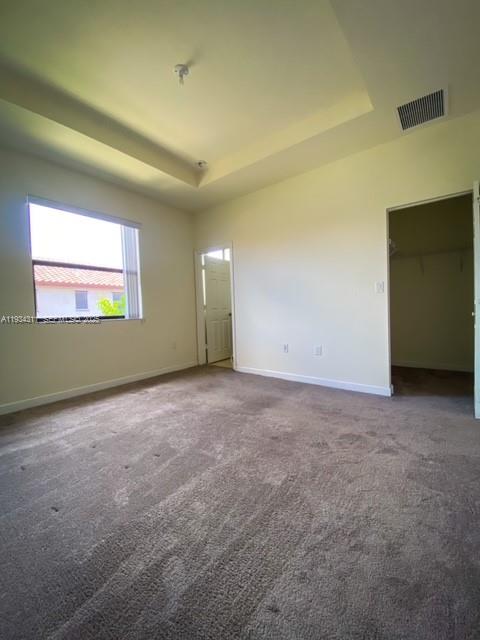 11487 Southwest 248th Lane Homestead, FL 33032 - Photo 10 of 16 an empty room with a empty space and windows