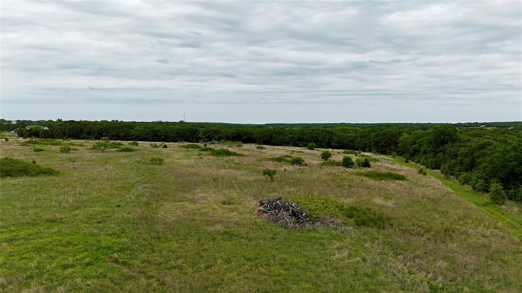 261 Catholic Cemetery Road Montague, TX 76251 - Photo 11 of 39 a view of a lake with houses in the back