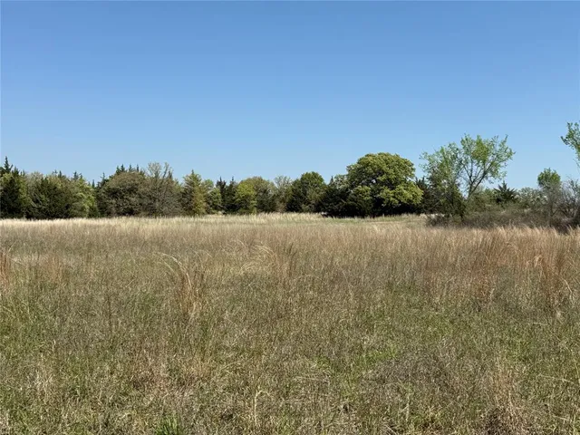 a view of a lake with a big yard