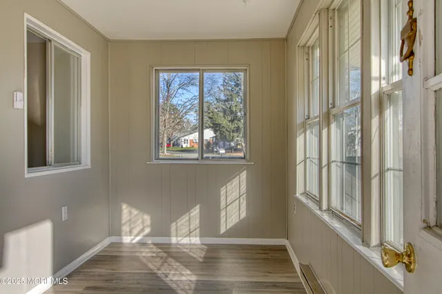 a view of a room with windows and lounge chair