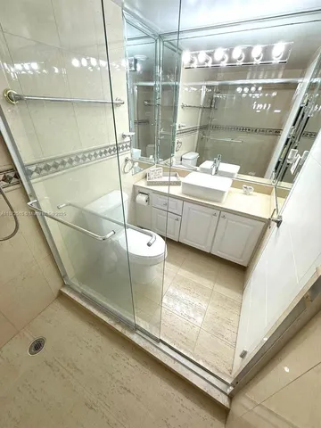 a bathroom with a sink and mirror