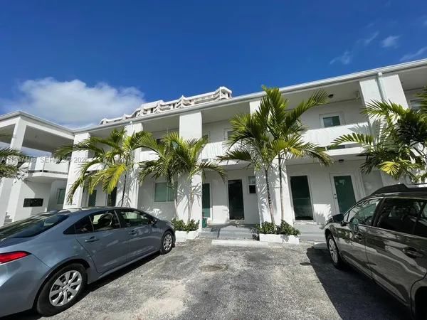a view of a car park in front of house