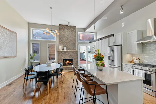 a view of a dining room with furniture and a kitchen
