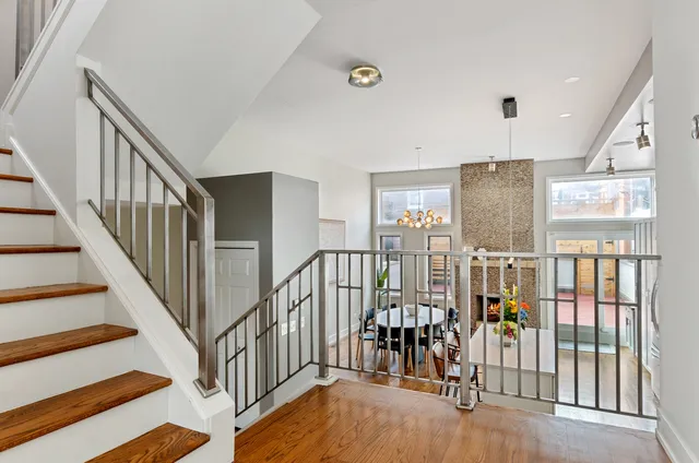 a view of entryway with wooden floor and windows