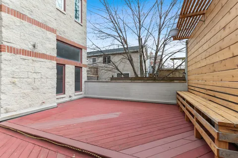 a view of a terrace with wooden walls