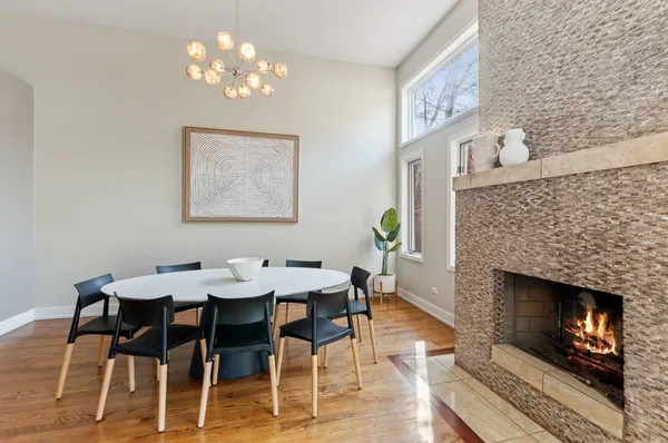 a view of a dining room with furniture and chandelier