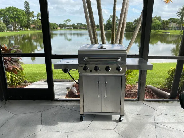 a view of a chairs and table in the balcony