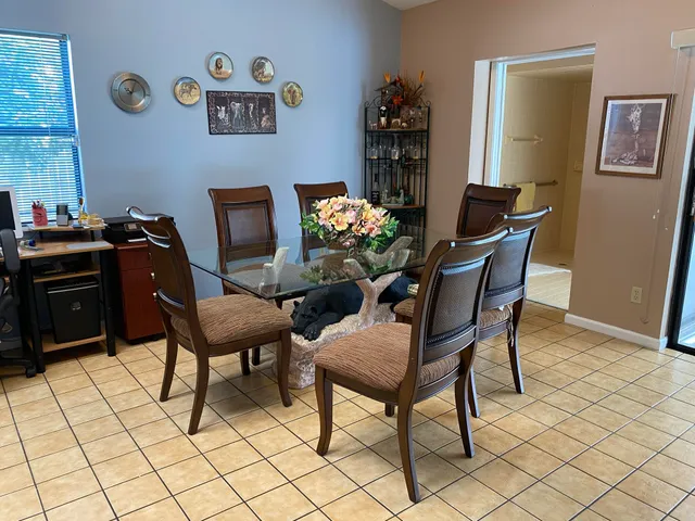 a kitchen with stainless steel appliances granite countertop a sink a refrigerator and a stove