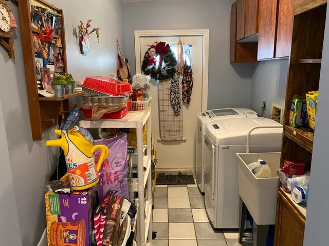 a picture of a living room with furniture and mirror