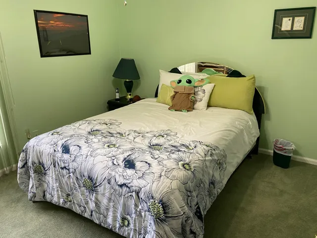 a bedroom with a bed and a bathroom