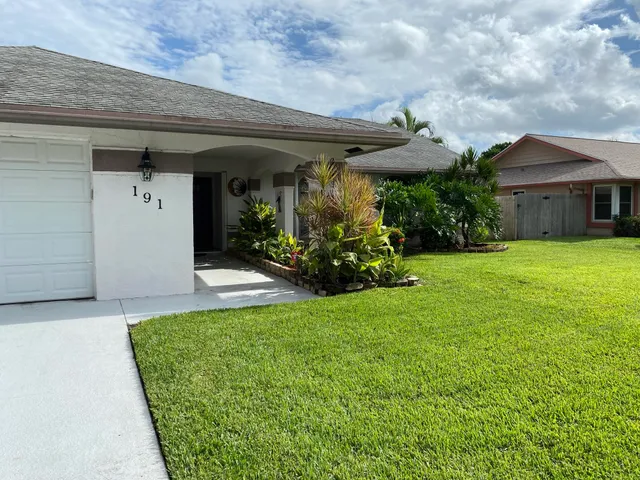 a view of a house with garden