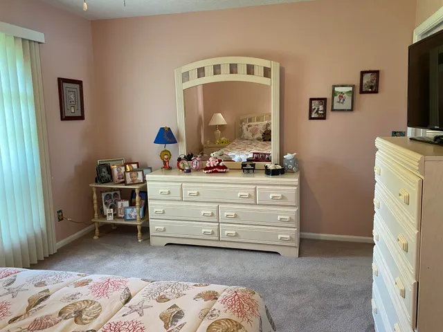 a bathroom with a toilet a sink and a mirror
