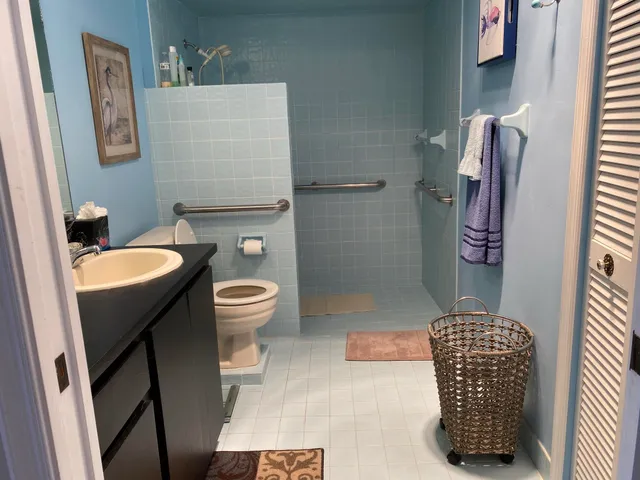 a bathroom with a sink a mirror and a window