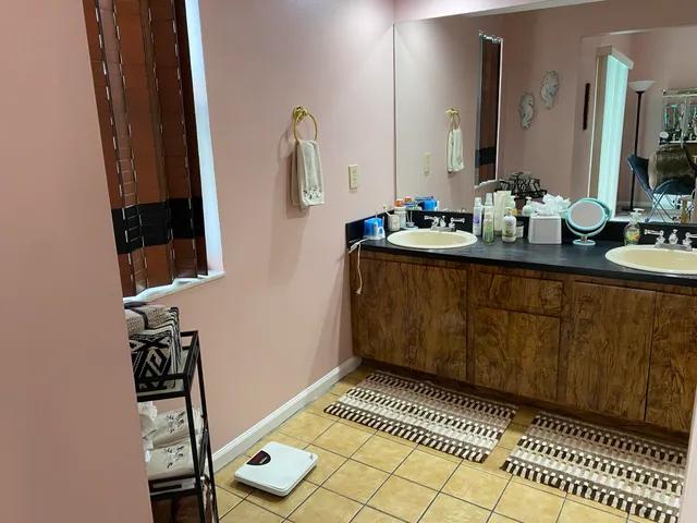 a bathroom with a toilet and a shower curtain