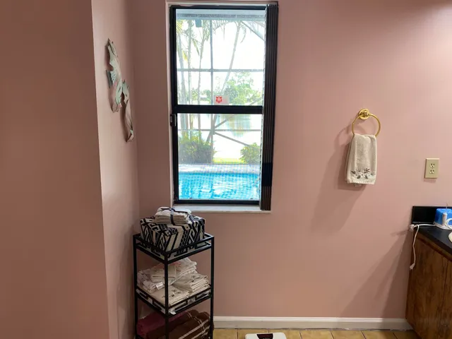 a bathroom with a sink mirror and vanity
