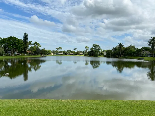 a view of a lake with houses in the back
