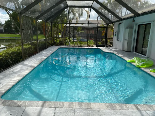 a view of a swimming pool with a patio